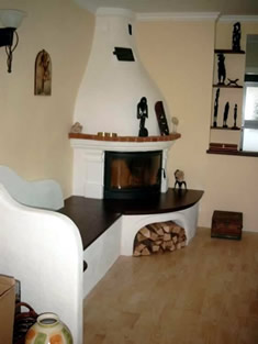 KAMINOFEN | Finnischer Kamin ummauert mit Ziegel- und Steindekor